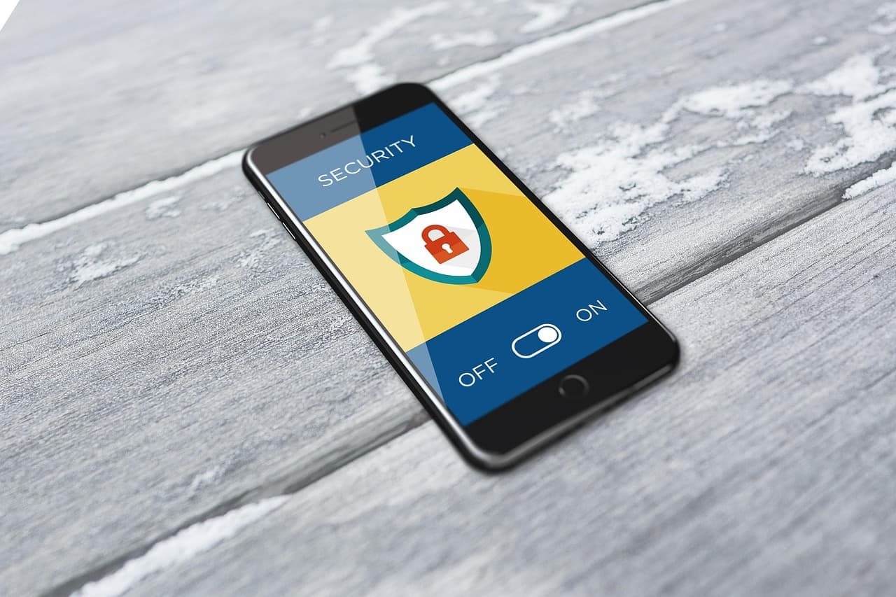 A smartphone showing a security screen with a shield-and-padlock icon and an on/off toggle