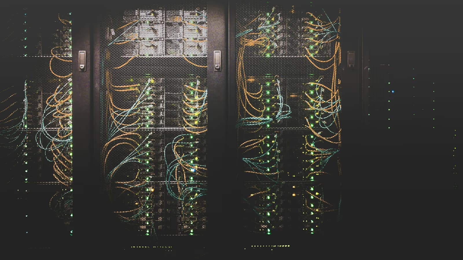 Colorful network cables in a datacenter — metaphor for the unencrypted metadata flowing between client and cloud server.